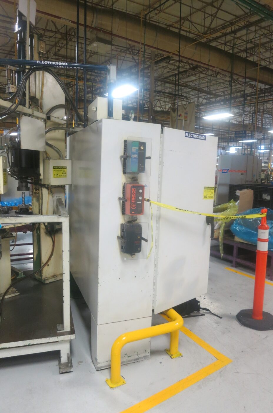 Electrical cabinet on the plant floor next to the assembly machine